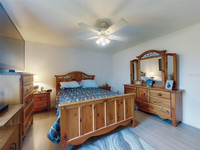 bedroom featuring ceiling fan and light wood-type flooring