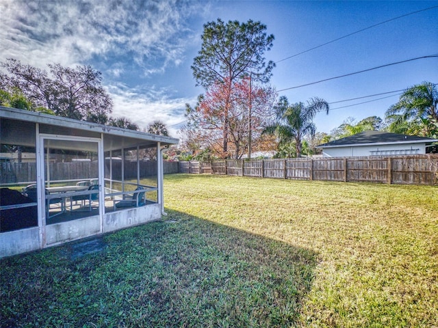 view of yard featuring a sunroom