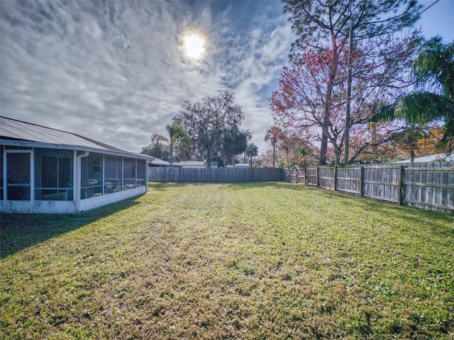 view of yard with a sunroom