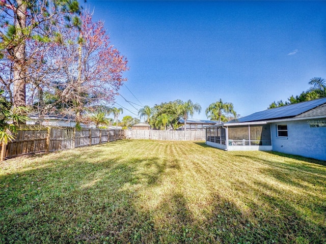 view of yard with a sunroom