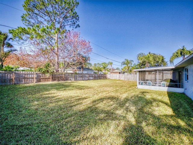 view of yard with a sunroom