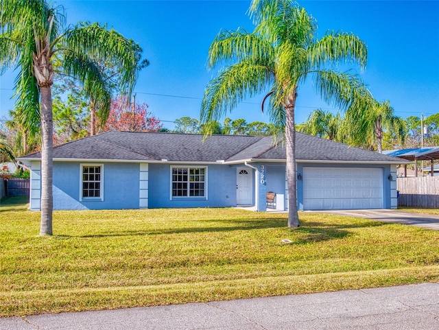 ranch-style home with a front yard and a garage