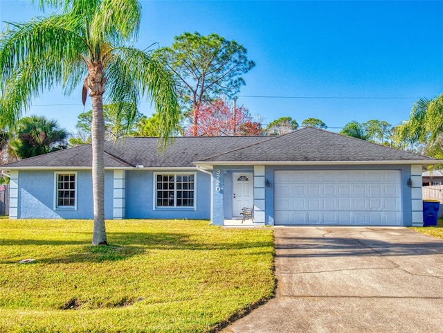 single story home with a front lawn and a garage