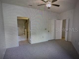 unfurnished room with ceiling fan