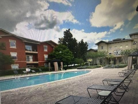 126 Vista Verdi Cir Unit 204, Lake Mary, FL 32746 - community pool featuring a patio area