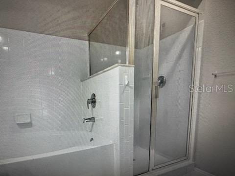 126 Vista Verdi Cir Unit 204, Lake Mary, FL 32746 - bathroom with a shower with shower door and a tub to relax in