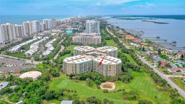 birds eye view of property with a water view