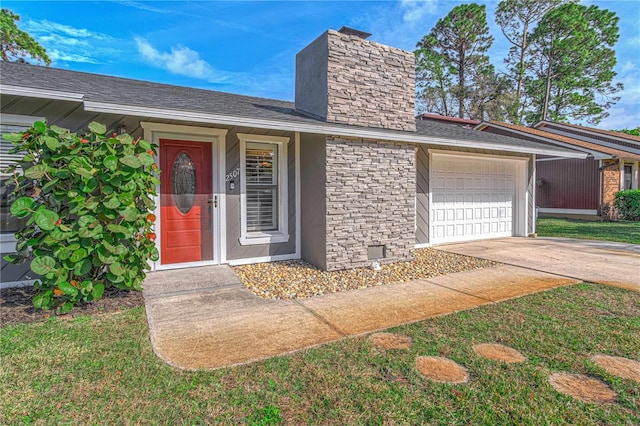 view of exterior entry with a garage