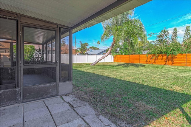 view of yard featuring a sunroom