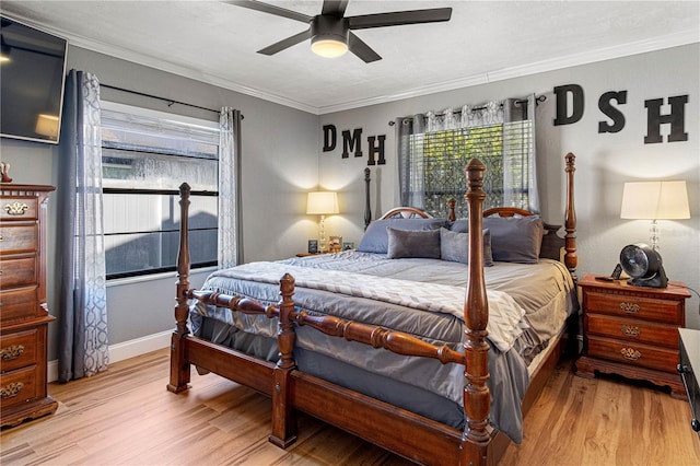 bedroom with ceiling fan, light wood-type flooring, and crown molding