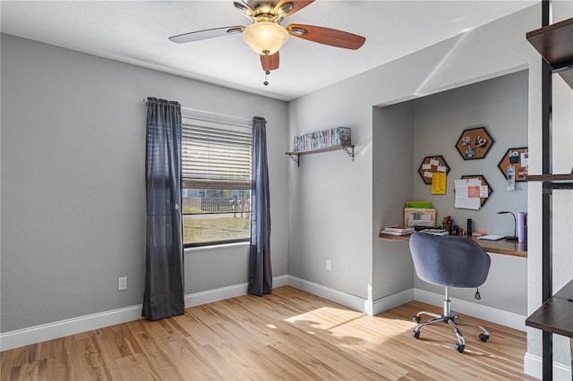 home office featuring ceiling fan and light hardwood / wood-style floors