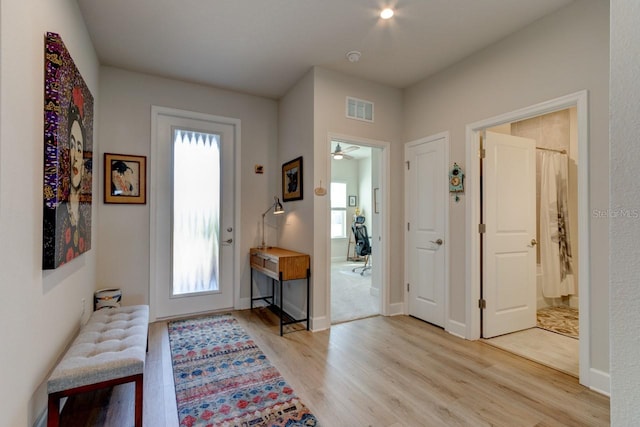 foyer featuring ceiling fan and light wood-type flooring