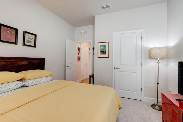 bedroom featuring light carpet