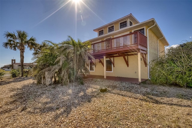 back of property with a wooden deck