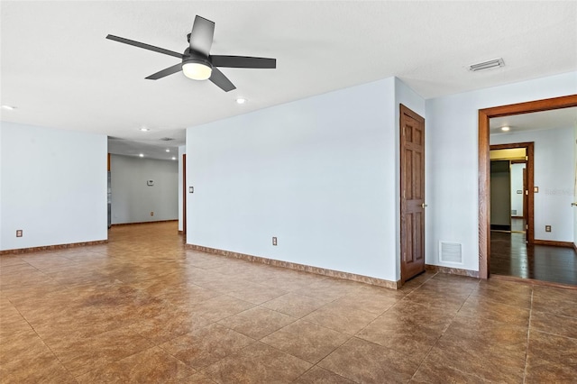 spare room with ceiling fan