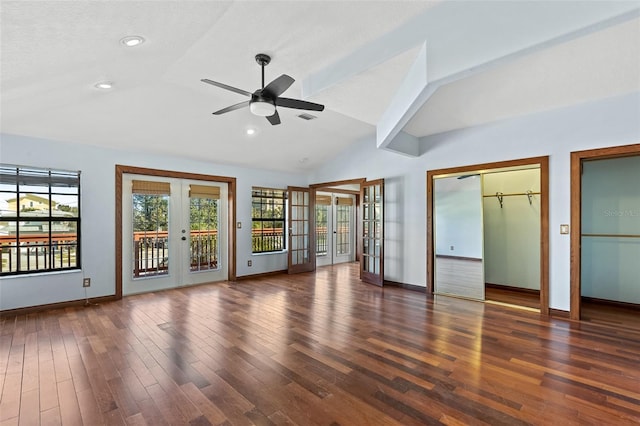 interior space featuring ceiling fan, french doors, vaulted ceiling, and dark hardwood / wood-style floors