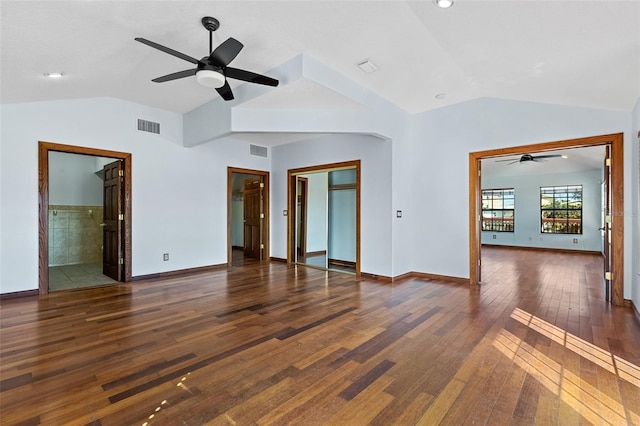 spare room with lofted ceiling, ceiling fan, and dark wood-type flooring