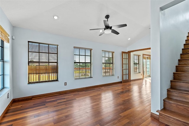 spare room with lofted ceiling, ceiling fan, and dark hardwood / wood-style flooring