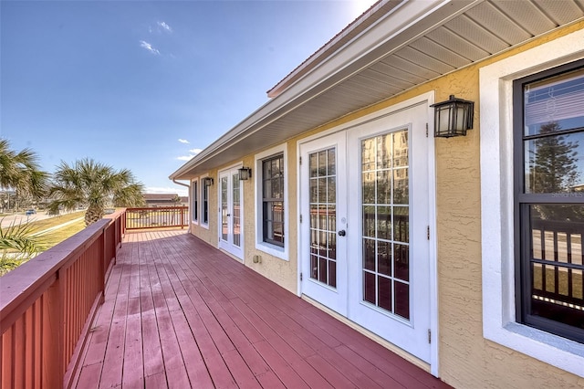 wooden terrace featuring french doors