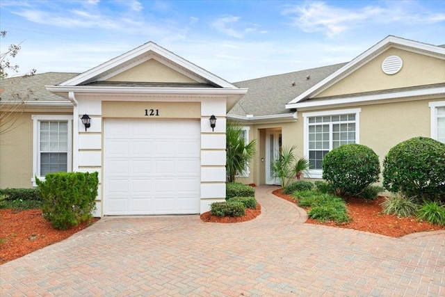 single story home featuring a garage