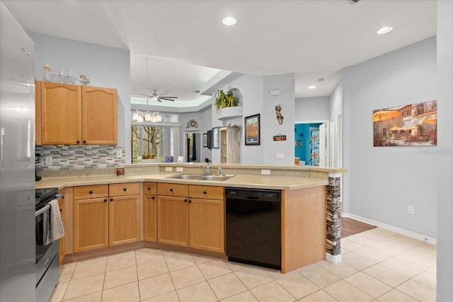 kitchen featuring kitchen peninsula, stainless steel appliances, ceiling fan, sink, and light tile patterned flooring