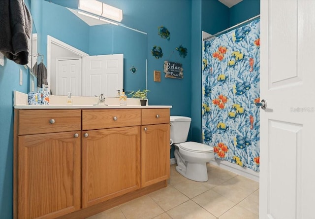 bathroom featuring a shower with curtain, tile patterned flooring, vanity, and toilet