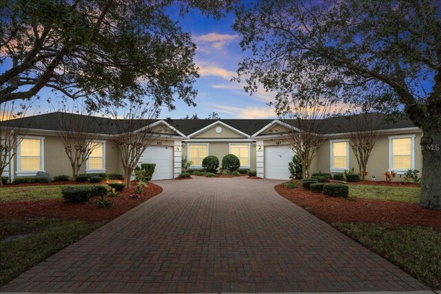 ranch-style house featuring a garage