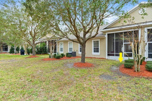 view of yard featuring a sunroom