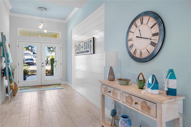 foyer with french doors and ornamental molding