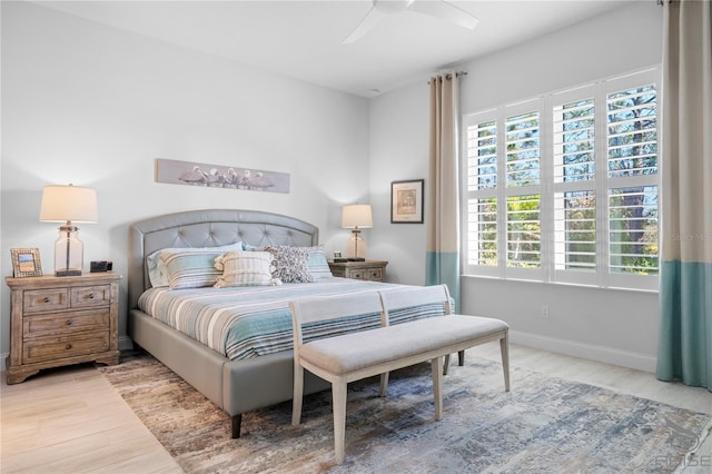 bedroom with ceiling fan and light hardwood / wood-style floors