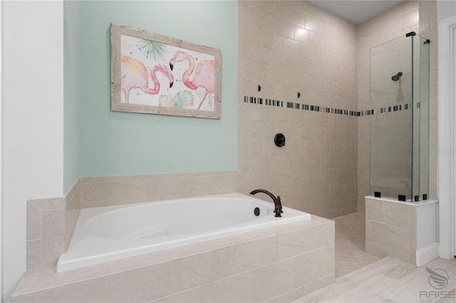 bathroom featuring tile patterned flooring and independent shower and bath