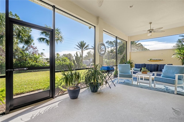 sunroom with ceiling fan and plenty of natural light