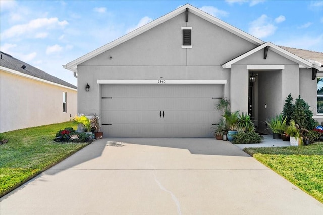 view of front of property with a garage and a front yard