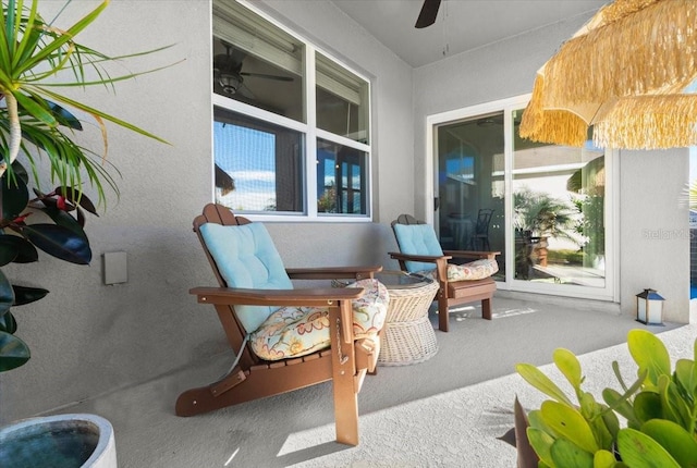 view of patio featuring ceiling fan