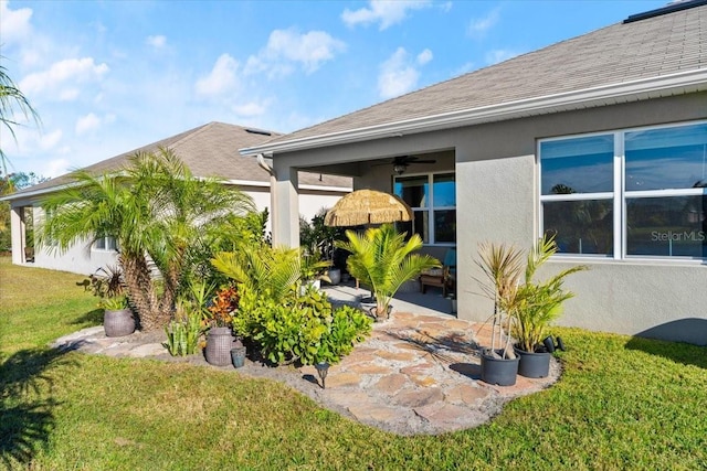 exterior space with a yard, a patio, and ceiling fan