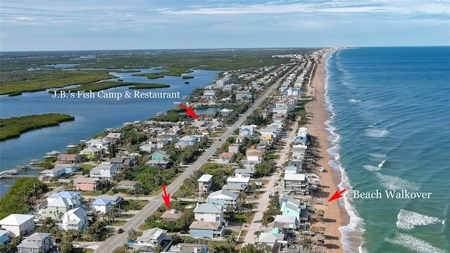 aerial view featuring a water view and a beach view