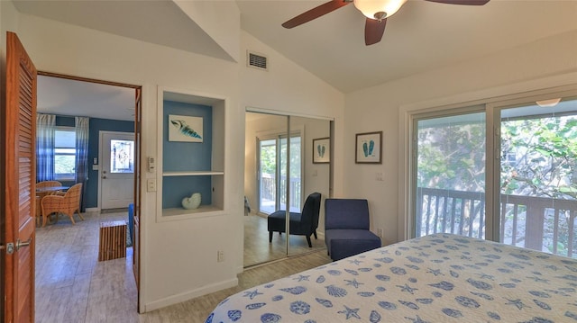 bedroom featuring lofted ceiling, access to exterior, a closet, light wood-type flooring, and ceiling fan