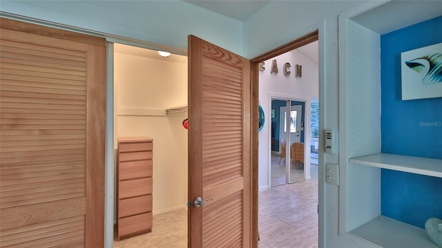 hall with light wood-type flooring