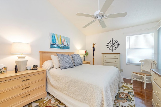 bedroom with lofted ceiling, ceiling fan, and dark hardwood / wood-style flooring