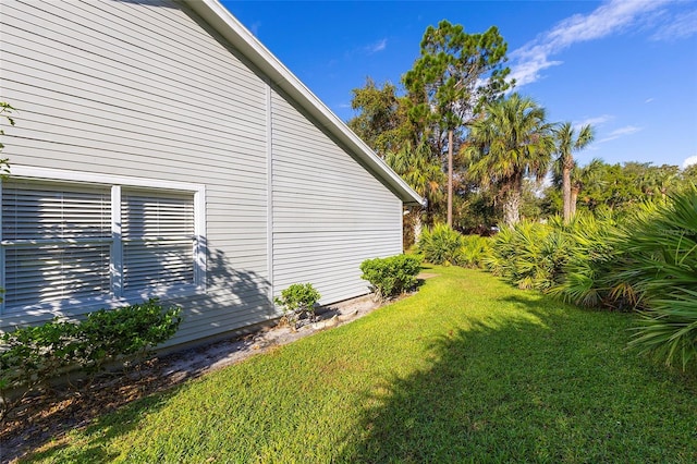 view of home's exterior with a lawn