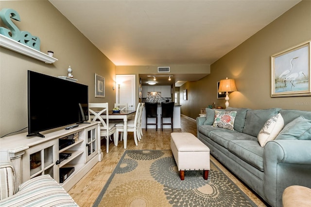 living room with light hardwood / wood-style floors