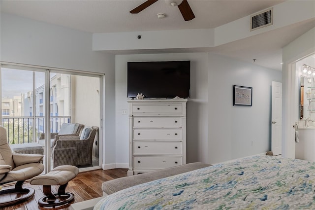 bedroom featuring ensuite bathroom, hardwood / wood-style floors, and ceiling fan