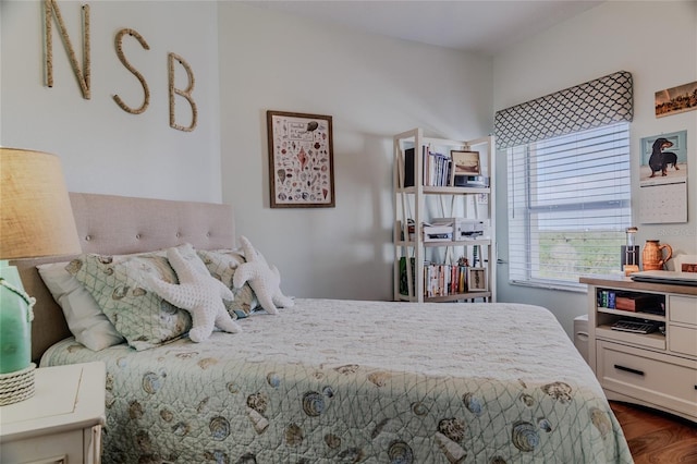 bedroom featuring dark hardwood / wood-style flooring