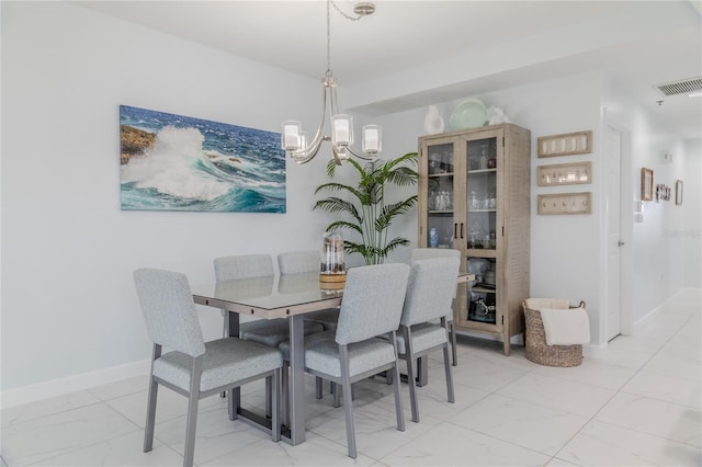 dining area featuring a chandelier