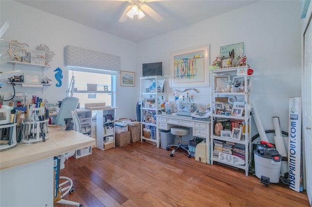 office space with wood-type flooring and ceiling fan