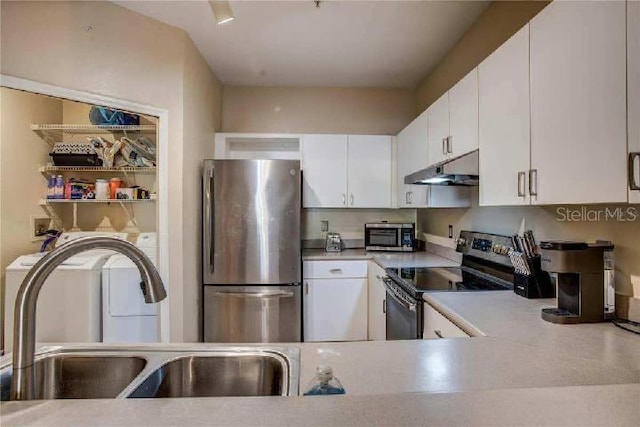 kitchen with sink, white cabinets, and appliances with stainless steel finishes