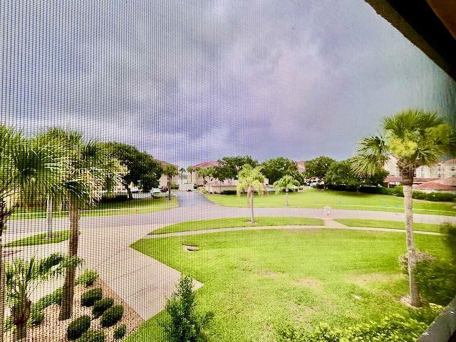 view of home's community featuring a yard