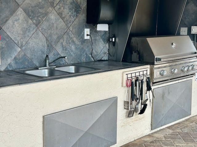 kitchen with decorative backsplash and sink