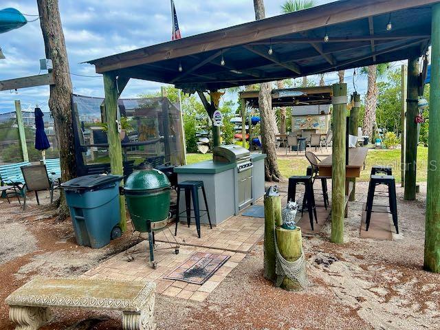 view of patio featuring grilling area, area for grilling, and a bar