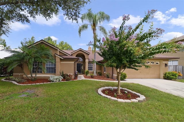 single story home featuring a front lawn and a garage